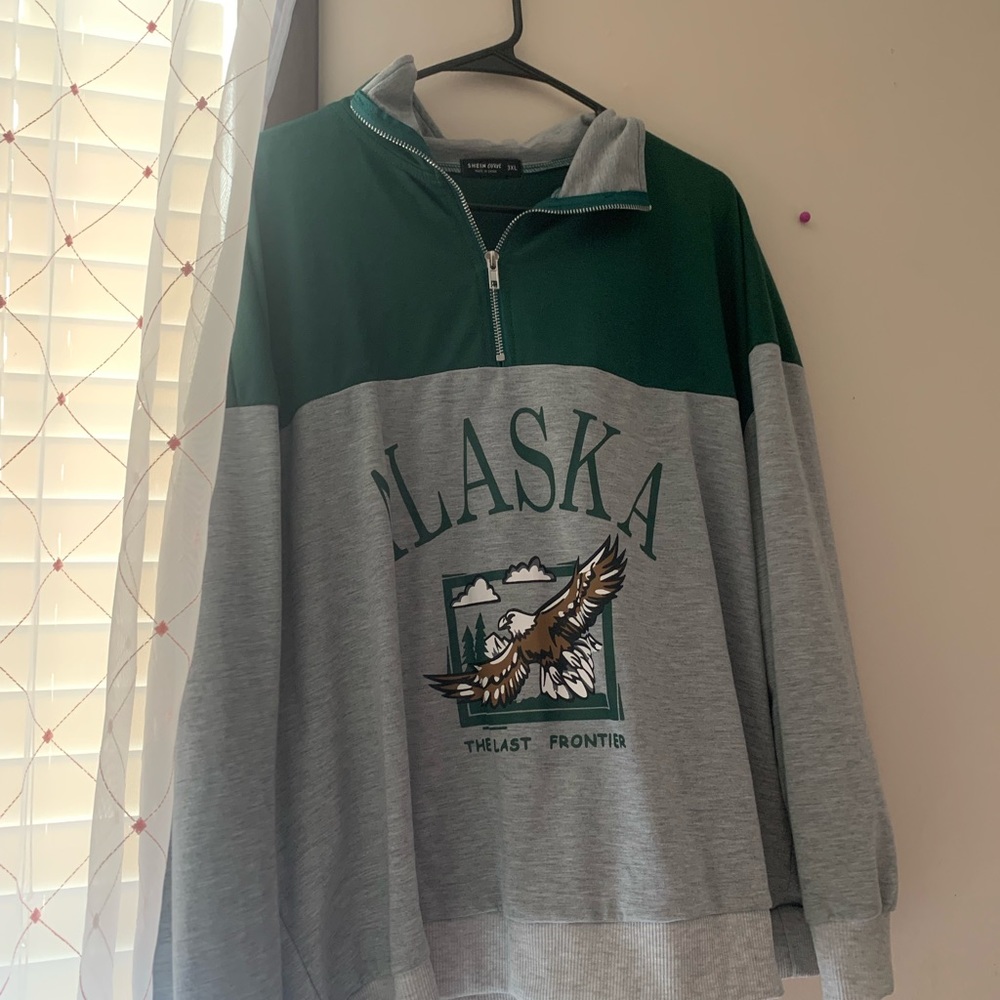 Alaska green and grey crew neck.